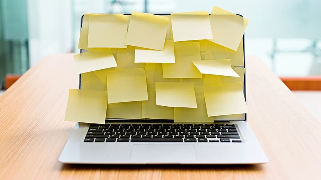 Covering laptop camera with sticky notes